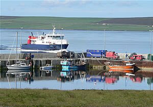 The ferry arrives at Sanday&rsquo;s Loth Pier, with Eday visible in the background.  &copy; Roderick Thorne